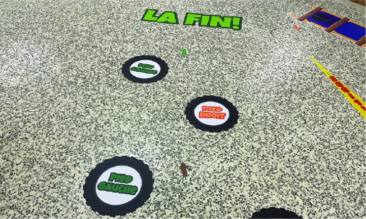 Colorful sensory path with circles and signs for kids' play and learning.