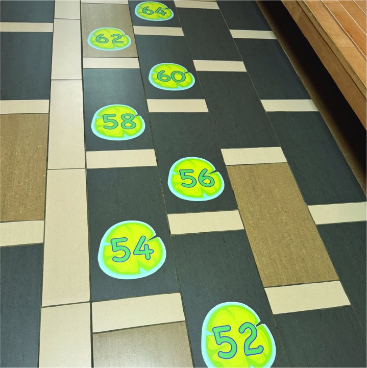 Colorful numbered stepping stones for sensory path activities in a school or therapy setting.