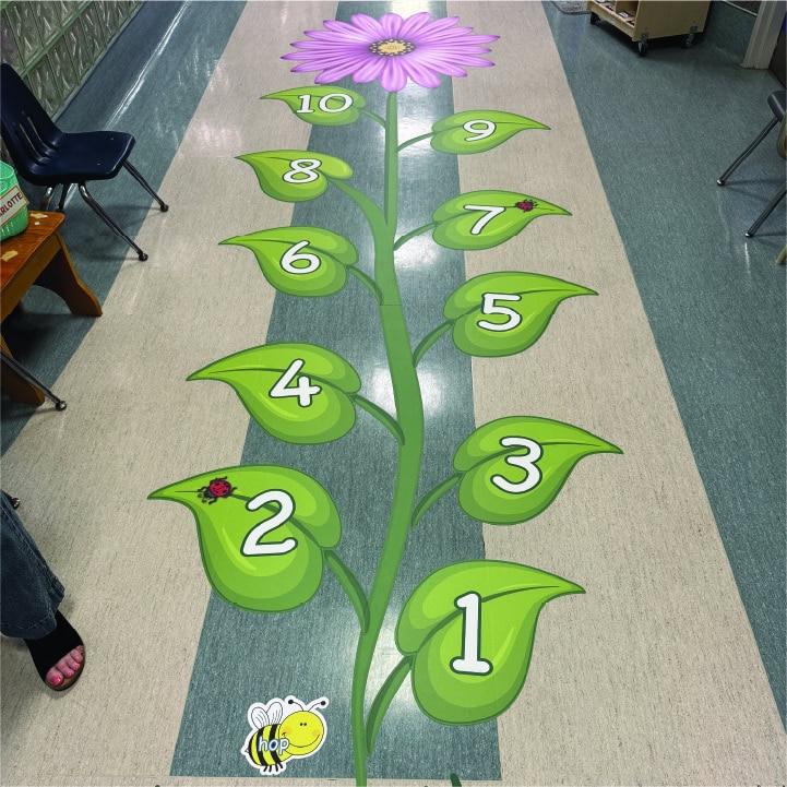 Colorful flower-shaped sensory path with numbered steps for children.