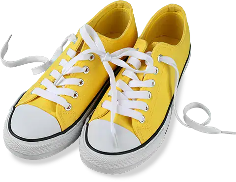 Colorful yellow kids' sneakers with white laces and rubber soles.
